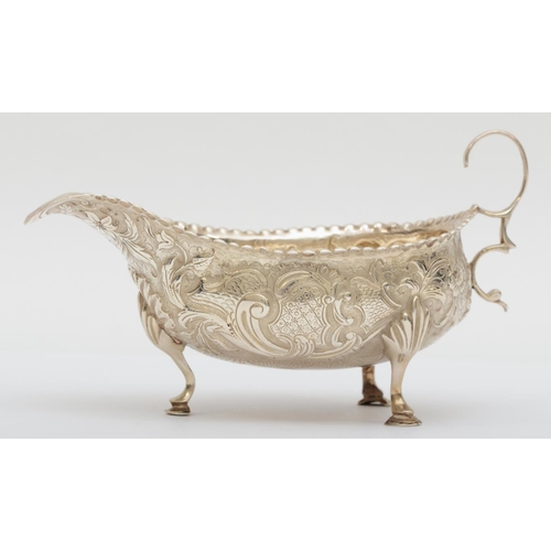 64 - A George III silver sauce boat, By Peter and Ann Bateman, London 1791, later embossed and chased wit... 