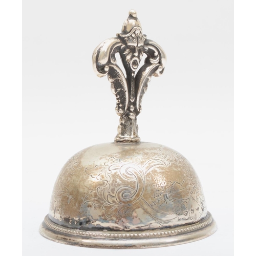 15 - A Swedish silver table bell, by C.C., 1863, with mask handle and floral engraved body, ball clanger,... 