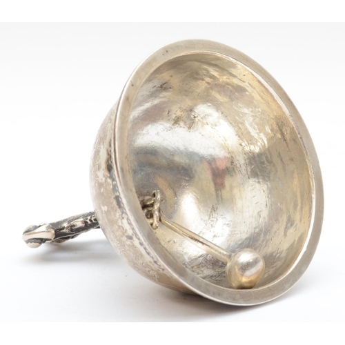 15 - A Swedish silver table bell, by C.C., 1863, with mask handle and floral engraved body, ball clanger,... 