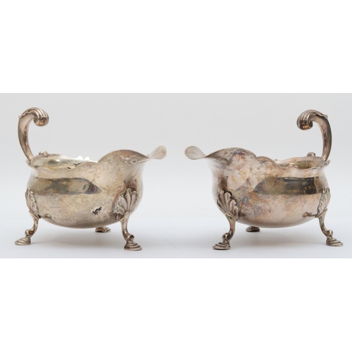 66 - A good pair of George II silver gravy boats, by William Shaw & William Priest, London 1759, with wav... 