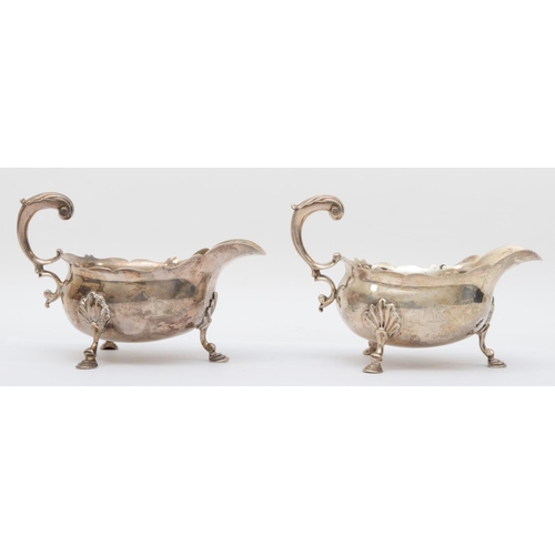 66 - A good pair of George II silver gravy boats, by William Shaw & William Priest, London 1759, with wav... 