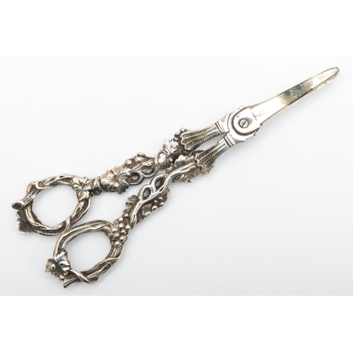 4 - A William IV silver pair of grape scissors, makers mark poorly struck, London 1831, with cast grape ... 