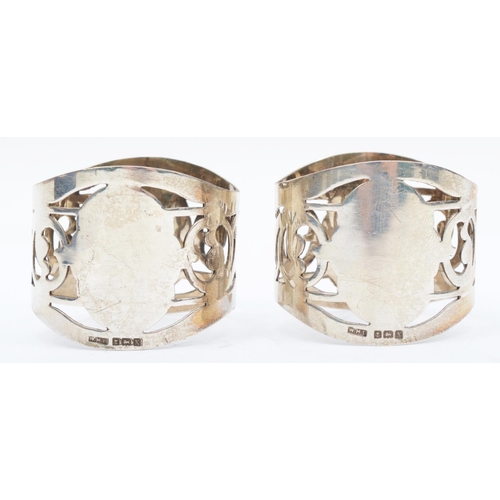 49 - A silver pair of napkin rings, Birmingham 1922, with pierced decoration, 41gm, cased