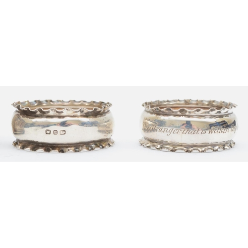 48 - A silver pair of napkin rings, Birmingham 1916, with engine turned decoration, 43gm, case and anothe... 