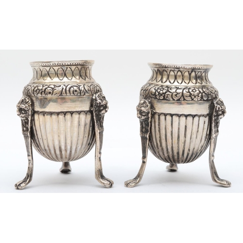 18 - A 19th century Italian silver pair of urns, Naples 1832-72, raised on three lion mask paw legs, 8cm,... 