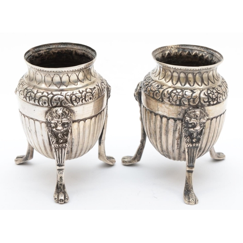 18 - A 19th century Italian silver pair of urns, Naples 1832-72, raised on three lion mask paw legs, 8cm,... 