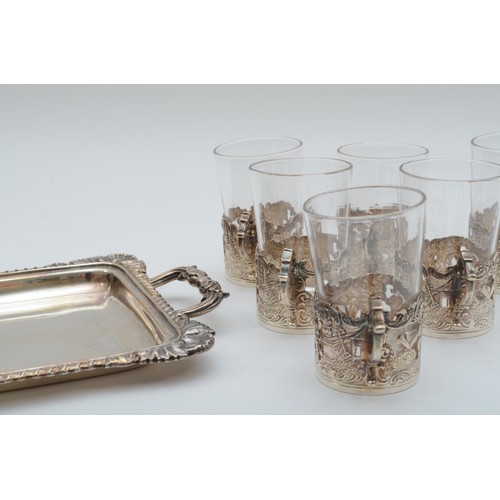 43 - An Edwardian silver and glass set of six cups, Sheffield 1902, with embossed pastoral scenes, togeth... 