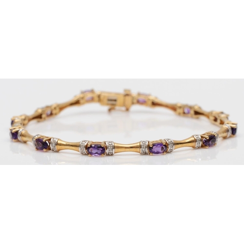 74 - A 9ct gold amethyst and diamond line bracelet, 19cm, 9.1gm