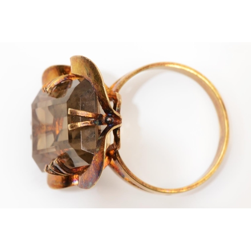 75 - A vintage gold smokey quartz dress ring, bearing unidentified control marks and maker SS, tests as 9... 