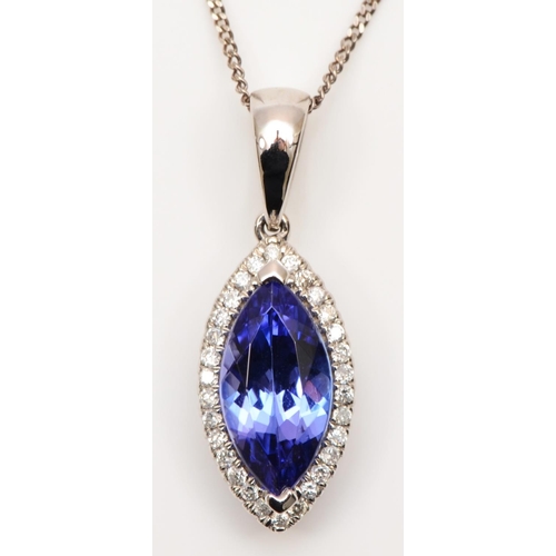 76 - A 14K white gold, tanzanite and brilliant cut diamond navette pendant, stone 11 x 6mm, of good colou... 