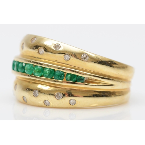 77 - A 14K gold emerald and diamond three row ring, gypsy set with brilliant cut stones, O, 5.7gm