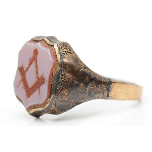 82 - A Victorian gold  and carved sardonyx Masonic signet ring, unmarked, tests 9ct gold, with floral eng... 