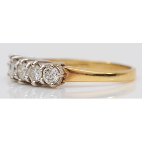 92 - An 18ct gold five stone diamond ring, claw set with brilliant cut stones, total weight approximately... 