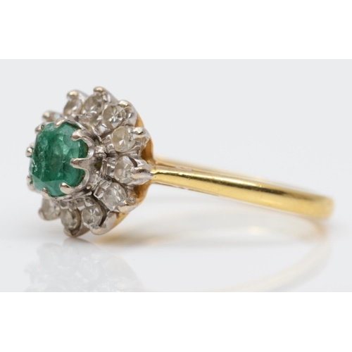 97 - An 18ct gold emerald and diamond cluster ring, London 1976, L 1/2, 4.1gm