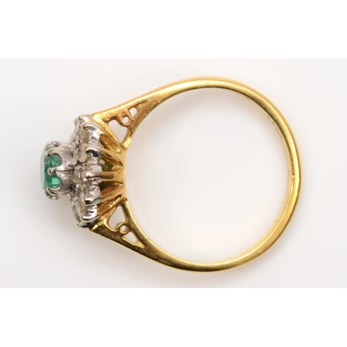 97 - An 18ct gold emerald and diamond cluster ring, London 1976, L 1/2, 4.1gm