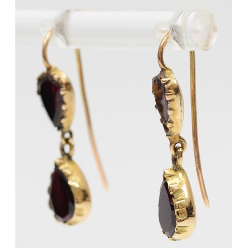 100 - A Victorian style pair of gold and flat top garnet ear rings, tests as 9ct gold, 25mm, 2,4gm