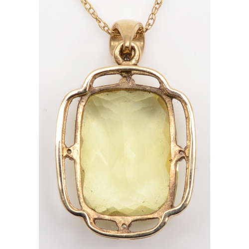 106 - A 9ct gold citrine and diamond pendant, the multi faceted stone measuring 20 x 15mm, the frame set w... 