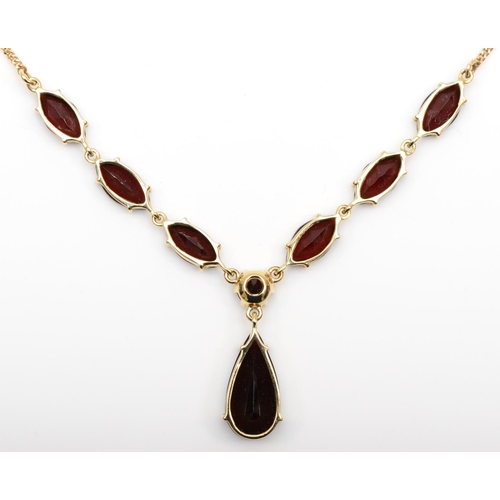 107 - A 9ct gold and garnet necklace, with pear shape drop, 16 x 8mm, to six navette stones, 39cm, 6.5gm