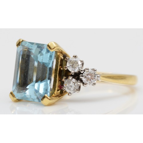 118 - An 18ct gold aquamarine and diamond dress ring, claw set with a step cut stone, 11 x 9mm, brilliant ... 