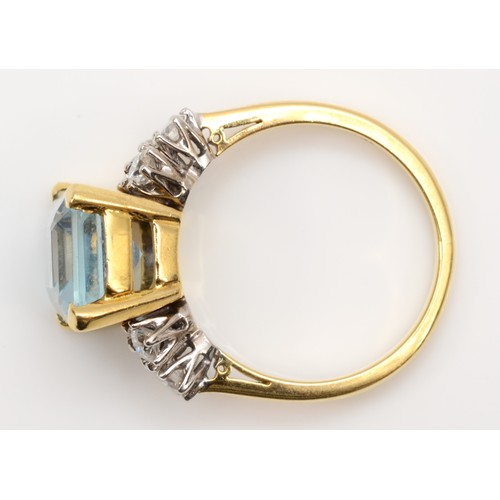 118 - An 18ct gold aquamarine and diamond dress ring, claw set with a step cut stone, 11 x 9mm, brilliant ... 