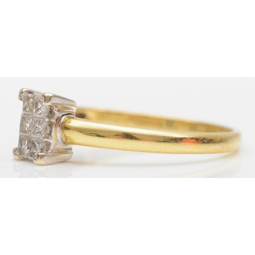 128 - An 18ct gold six Princess cut diamond panel ring, stated weight 0.20cts, O, 2.3gm