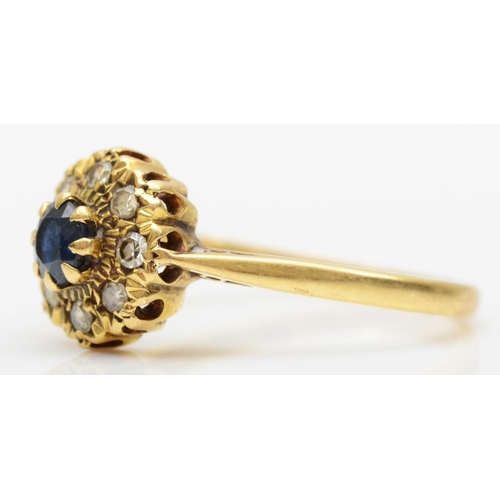 143 - A vintage 18ct gold sapphire and diamond cluster ring, P, 3.1gm