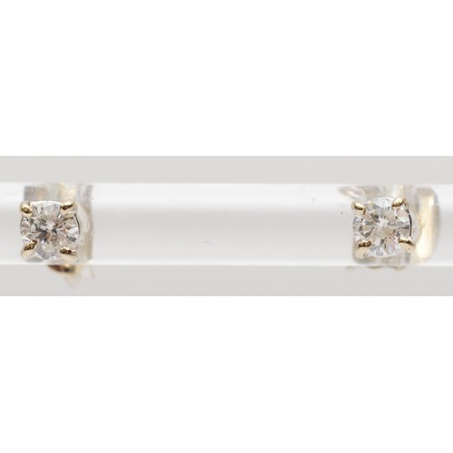 134 - A pair of 14ct white gold and brilliant cut diamond ear studs, approximately 0.15cts each, G/H, VS1/... 