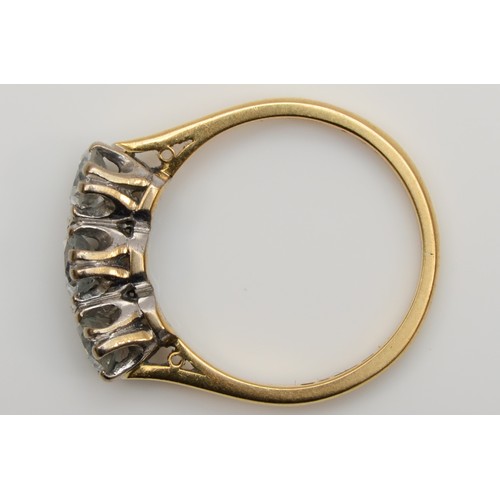 157 - An 18ct gold three stone diamond ring, London 1982, claw set with brilliant cut stones, approximatel... 