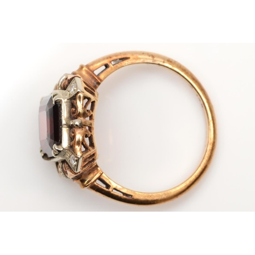 160 - A 9ct gold garnet panel ring, the claws set with diamonds, 14 x 14 mm overall, L 1/2, 4gm