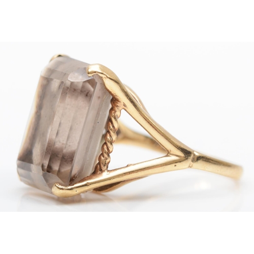 162 - A vintage 9ct gold and smokey quartz ring, London 1968, claw set with an emerald cut stone, 18 x 13m... 