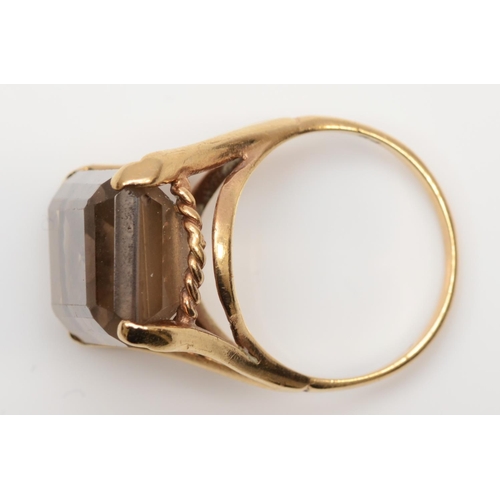 162 - A vintage 9ct gold and smokey quartz ring, London 1968, claw set with an emerald cut stone, 18 x 13m... 