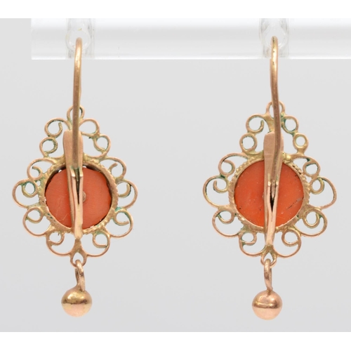 163 - A vintage pair of rose gold and coral ear rings, tests as 14K gold, 21mm overall, 2gm