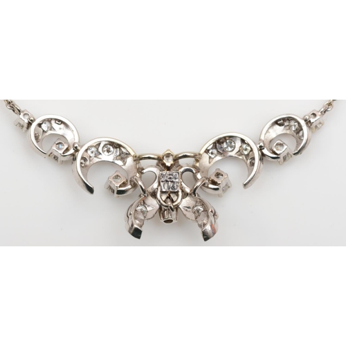 173 - A white gold and diamond necklace front, stamped 750, set with brilliant cut stones, 41mm front, 6.3... 