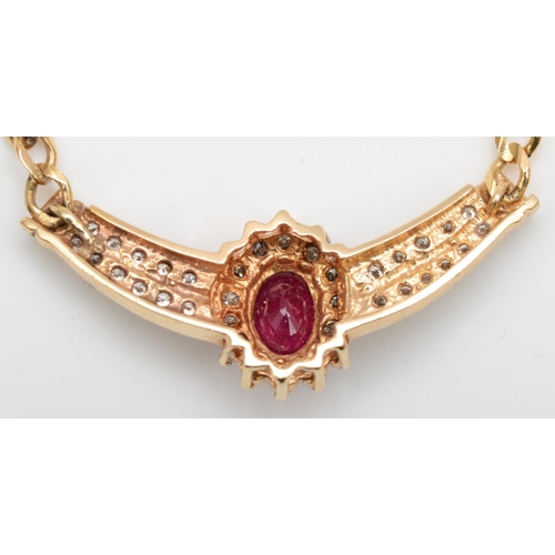 174 - A 14K gold ruby and diamond necklace, the central mixed cut stone, bordered by brilliants, similarly... 