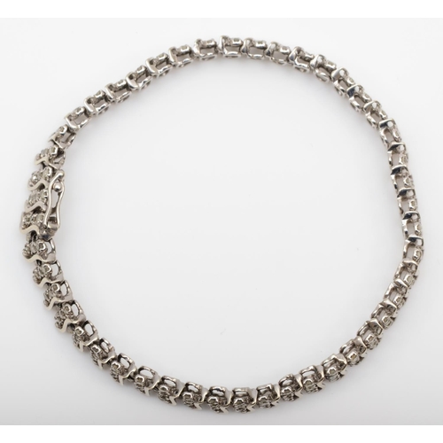 176 - A 9ct white gold and diamond line bracelet, claw set with rows of three stones, stated weight 2.00ct... 