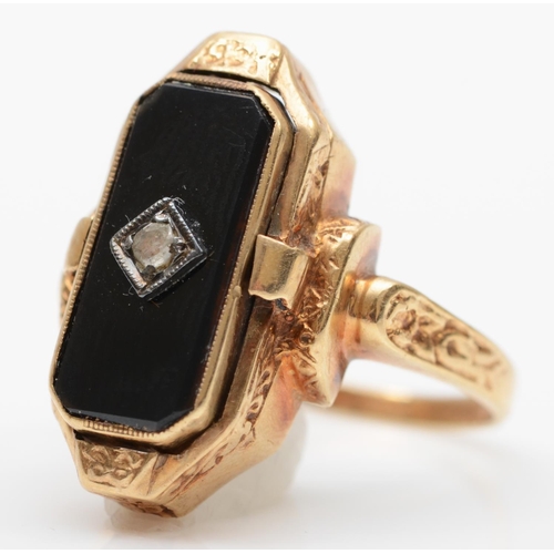 183 - An American 10K gold shell cameo/diamond set onyx panel swivel ring, signed Romany, for Stern & Ster... 