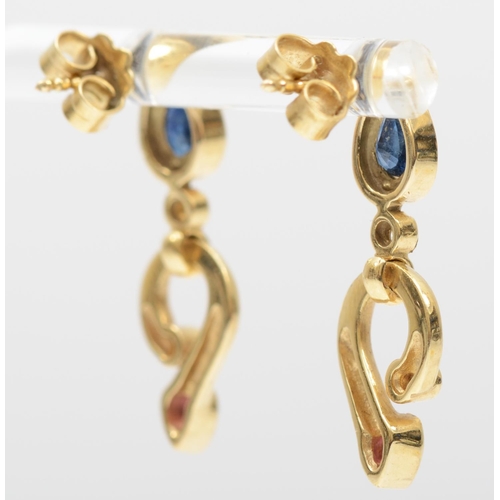 152 - A pair of 14K gold ruby, brilliant cut diamond and sapphire ear rings, 27mm, 4.7gm