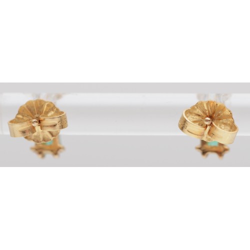 148 - A pair of gold emerald and diamond earstuds, the emerald cut stone with a brilliant above, 1gm