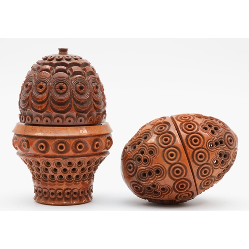 224 - Two 19th century carved wood eggs, thimble holders or pomanders, with screw oof covers, 6.5 and 5cm