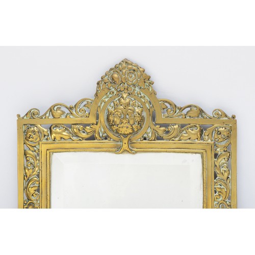 225 - A pair of early 20th century of brass girandole bevelled glass mirrors, with pierced and cast surrou... 