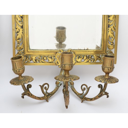 225 - A pair of early 20th century of brass girandole bevelled glass mirrors, with pierced and cast surrou... 