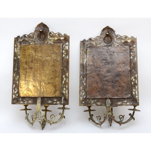 225 - A pair of early 20th century of brass girandole bevelled glass mirrors, with pierced and cast surrou... 