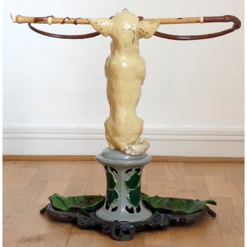 228 - A Victorian painted cast-iron umbrella stand
by Coalbrookdale, mid 19th century, modeled as a beggin... 