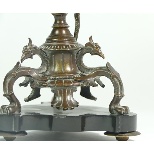 233 - A bronze tazza, the tripod base of sphinxes with climbing snake on a central baluster upright, raise... 