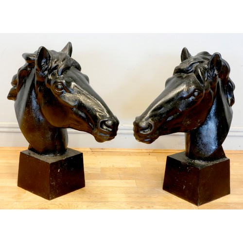 242 - A pair of metal horses heads, painted black, 62 x 58cm