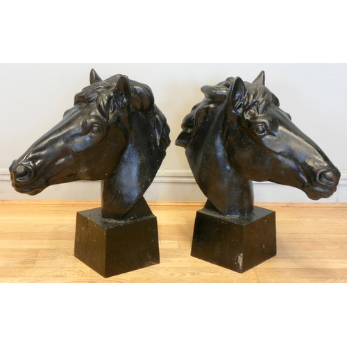 242 - A pair of metal horses heads, painted black, 62 x 58cm