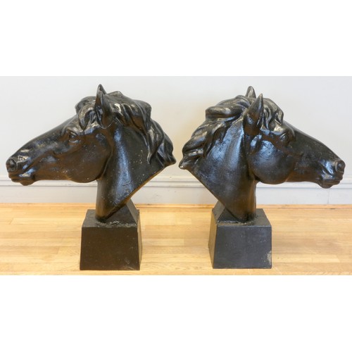 242 - A pair of metal horses heads, painted black, 62 x 58cm