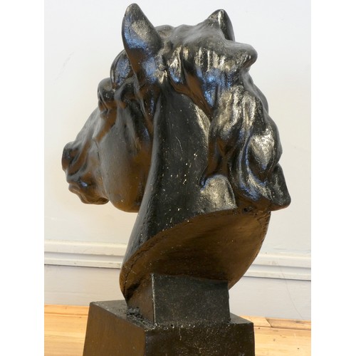 242 - A pair of metal horses heads, painted black, 62 x 58cm