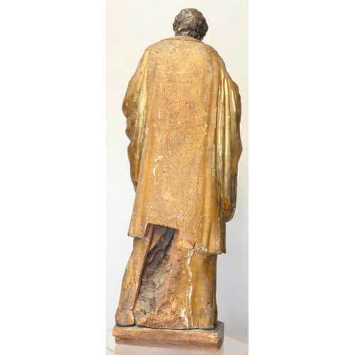 244 - A continental sculpted and gilt painted limewood model of a saint, in the 16th century style, 101cm.