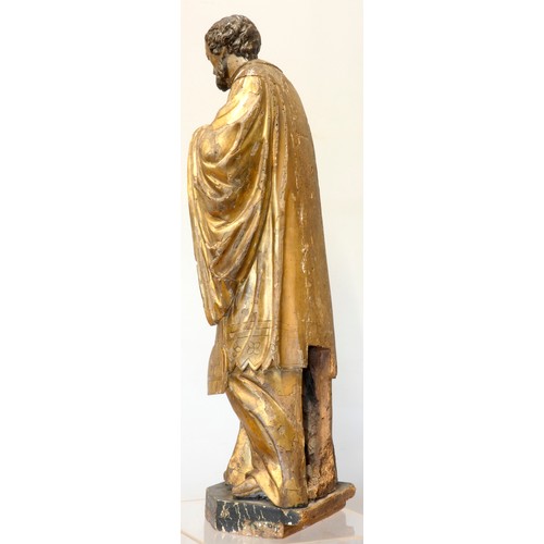 244 - A continental sculpted and gilt painted limewood model of a saint, in the 16th century style, 101cm.